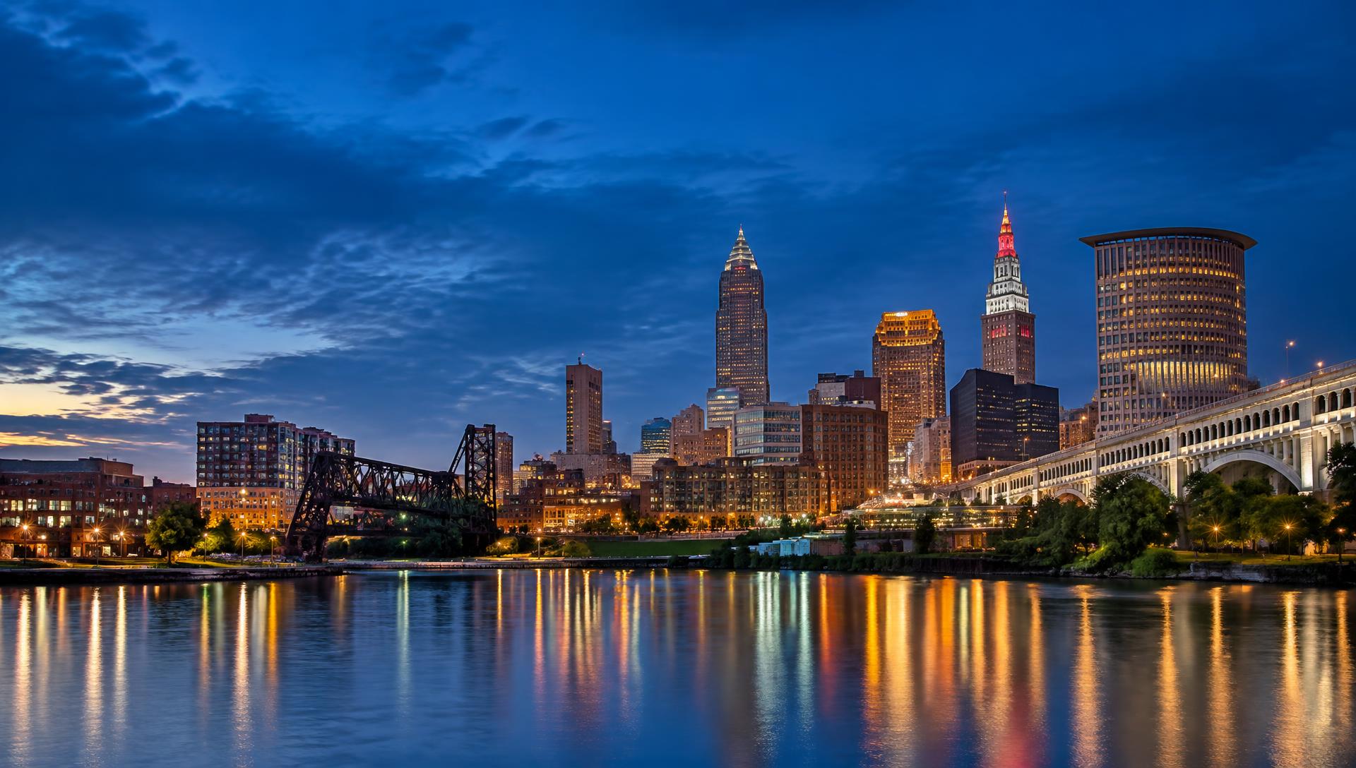 Cleveland skyline across the Cuyahoga River at blue hour